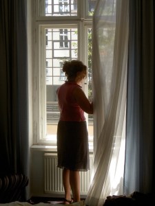 girl-in-window-1438579-639x852